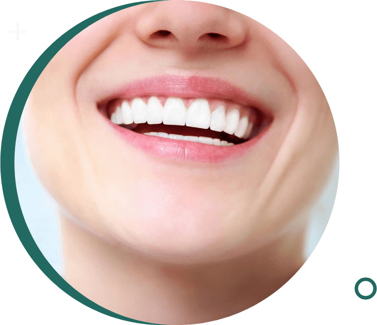 A close up of a person 's smile with green background