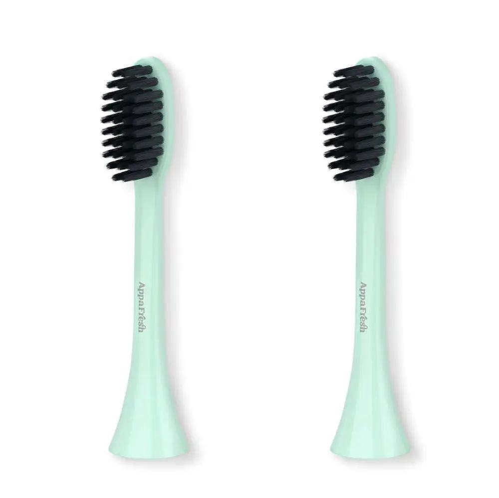 A pair of black and white toothbrushes on top of each other.