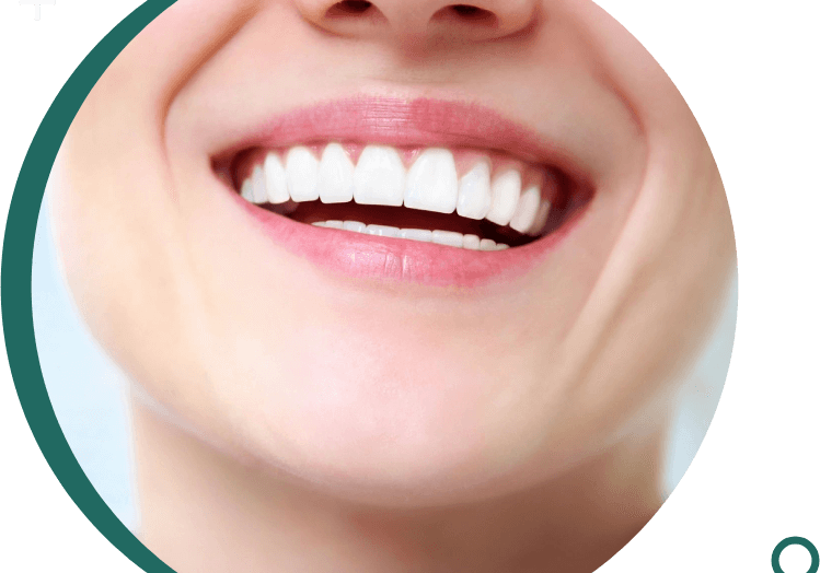 A close up of a person 's smile with green background